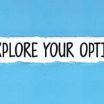 A creative visual metaphor on a blue background, showing a piece of paper torn away to reveal the phrase 'EXPLORE YOUR OPTIONS' with a light bulb made from crumpled yellow paper that appears illuminated, symbolizing a bright idea or innovation.