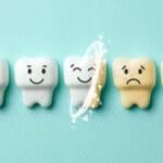 Row of five cartoon-style teeth on a teal background, showing different expressions and states. The three leftmost teeth are white and smiling, while the two on the right are yellowed with sad faces. A glowing swirl effect is shown transforming a sad, yellow tooth into a happy, white one, symbolizing dental cleaning or whitening.